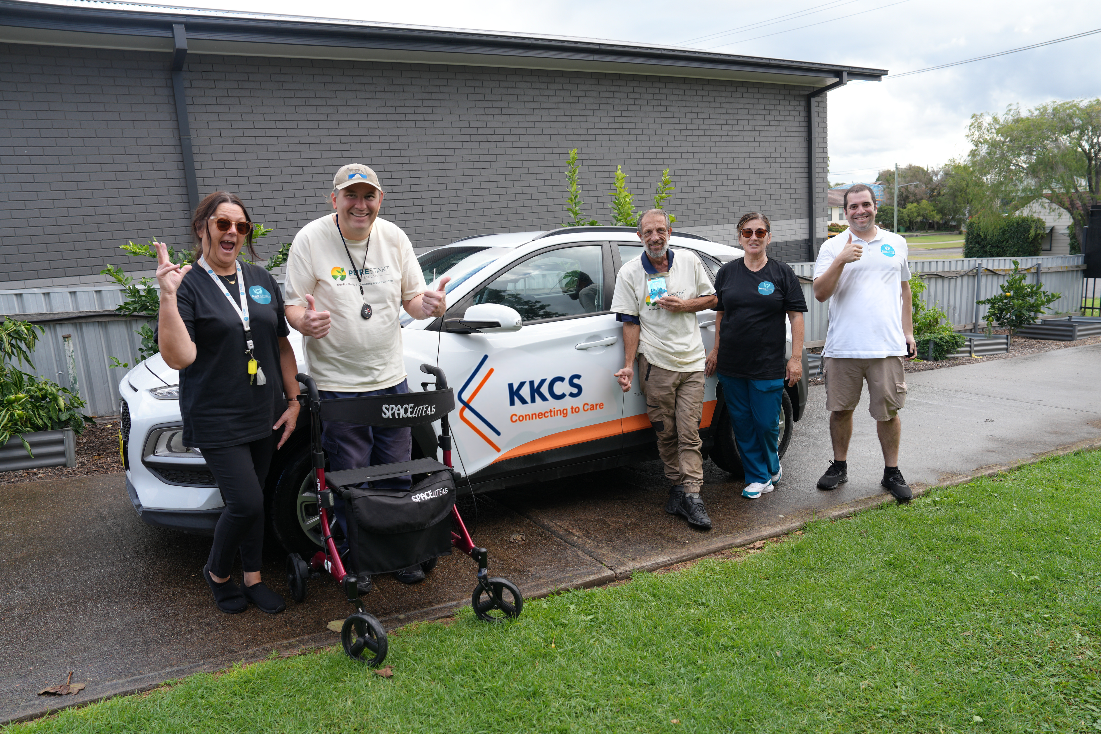 Pure Start team with branded vehicle