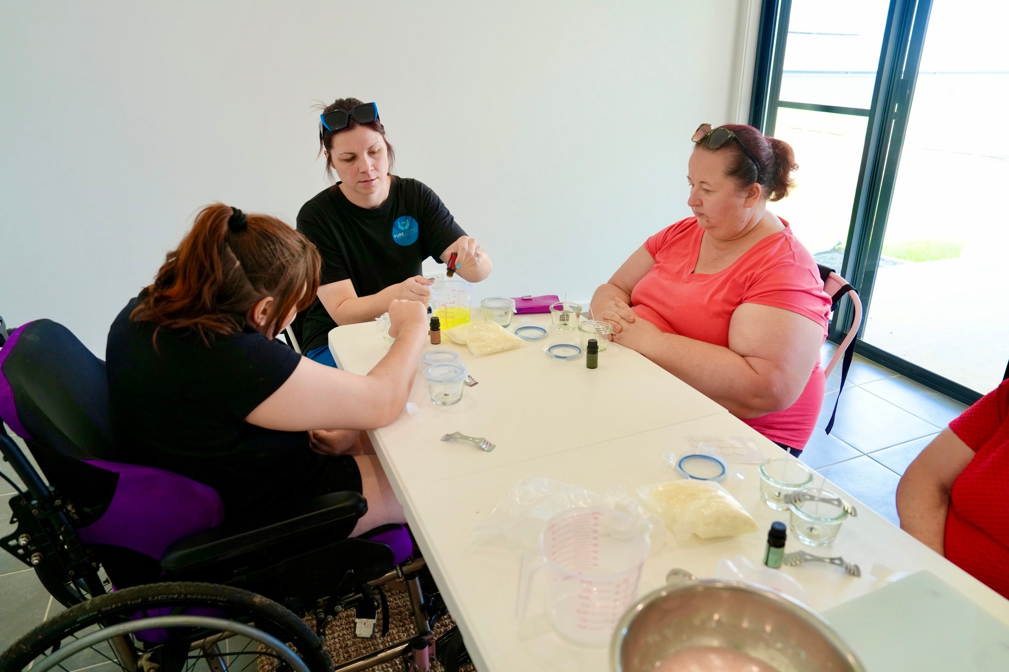 Participants making handcrafted candles at the Skills Hub
